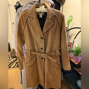 Leather trench style coat with animal print motif.